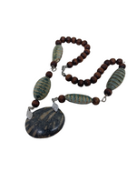 Woman's necklace/radiolaria pendant/chain: wood beads, cucaracha de mar, horn/ONLY 1/